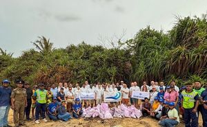 Emerson Leads a Beach Cleanup at Crow Island